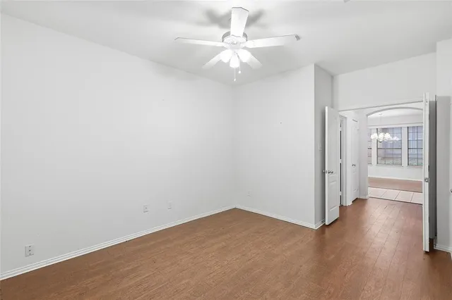 a bathroom with a toilet a sink and a mirror