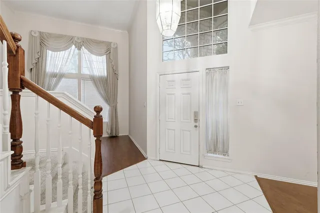 a view of front door with wooden floor