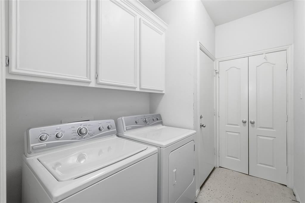 2216 Post Oak Court Corinth, TX 76210 - Photo 9 of 19 a utility room with dryer and washer