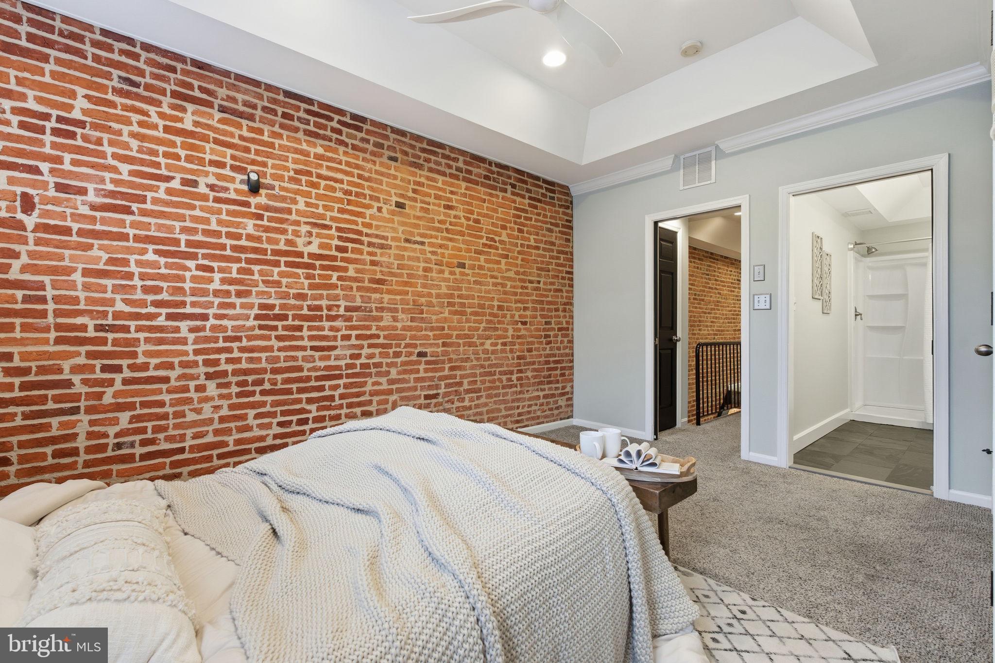 3135 Fait Avenue Baltimore, MD 21224 - Photo 14 of 35 a bedroom with a bed and a shower