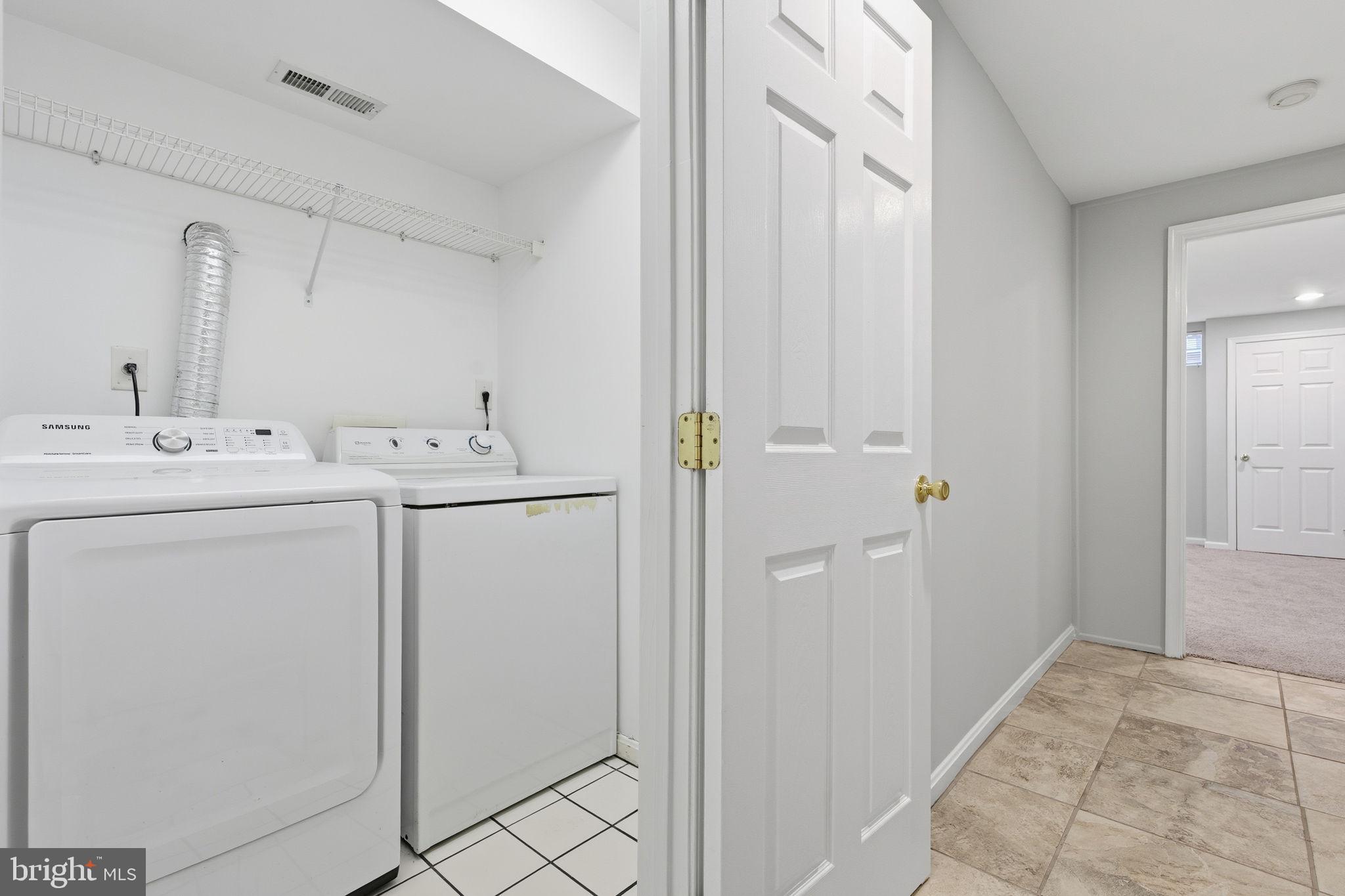 3135 Fait Avenue Baltimore, MD 21224 - Photo 27 of 35 a utility room with dryer and washer