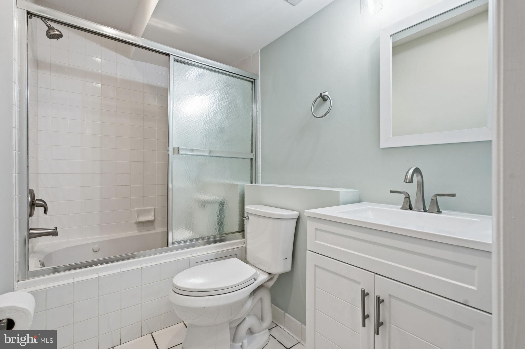 3135 Fait Avenue Baltimore, MD 21224 - Photo 29 of 35 a bathroom with a sink a toilet and shower