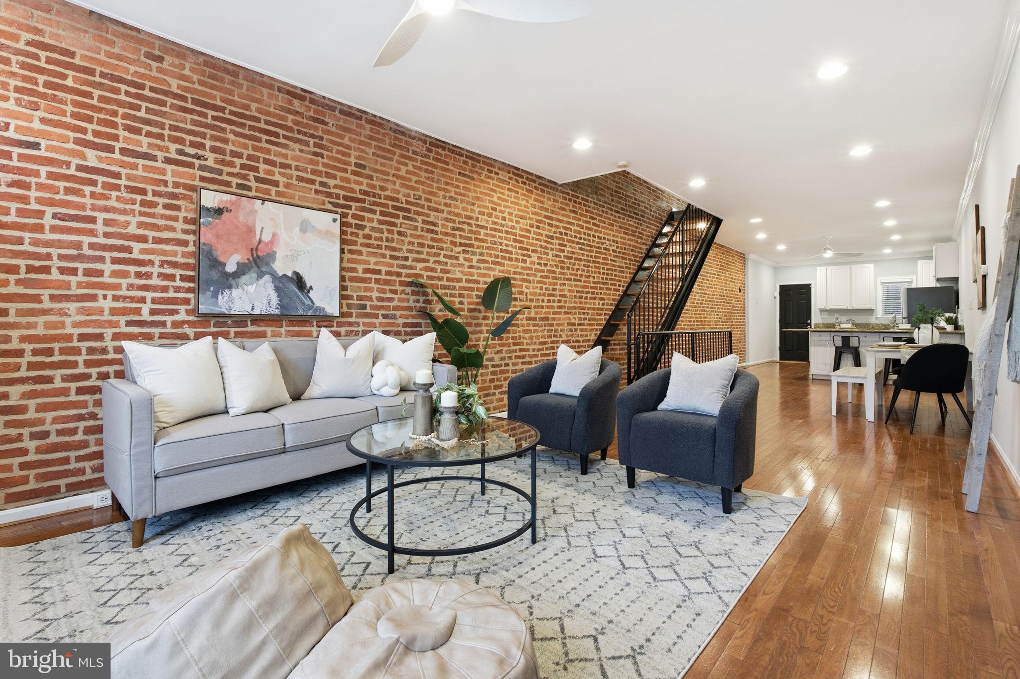 3135 Fait Avenue Baltimore, MD 21224 - Photo 3 of 35 a living room with furniture and a wooden floor