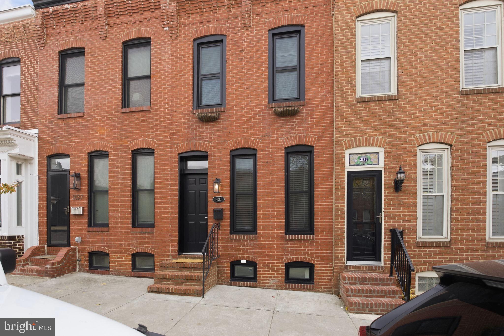 3135 Fait Avenue Baltimore, MD 21224 - Photo 34 of 35 a front view of a building with glass windows