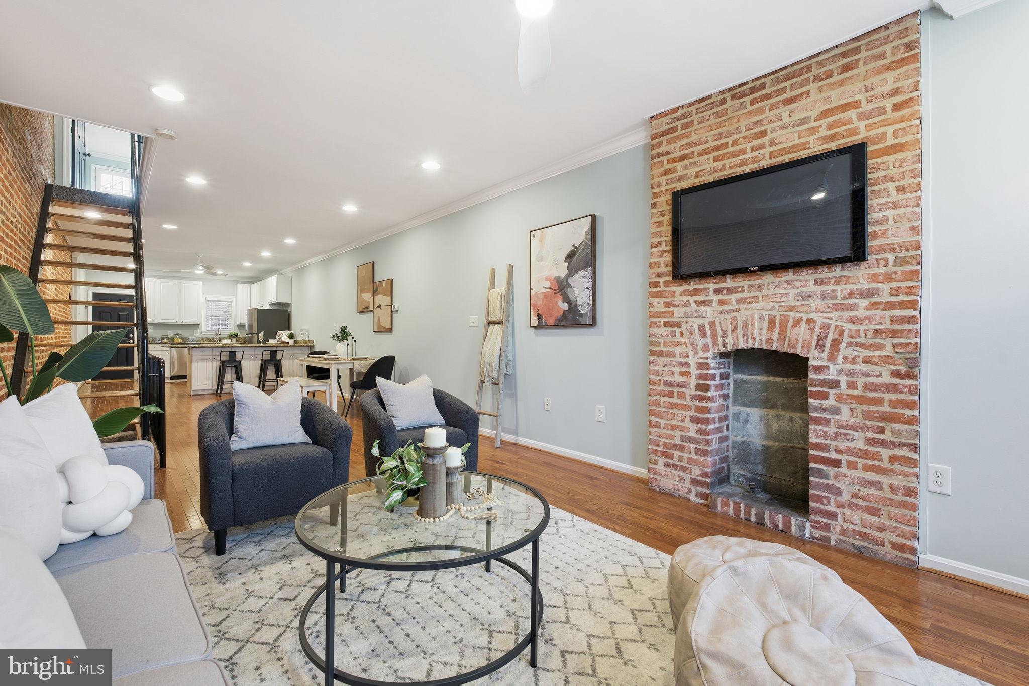 3135 Fait Avenue Baltimore, MD 21224 - Photo 4 of 35 a living room with furniture fireplace and flat screen tv