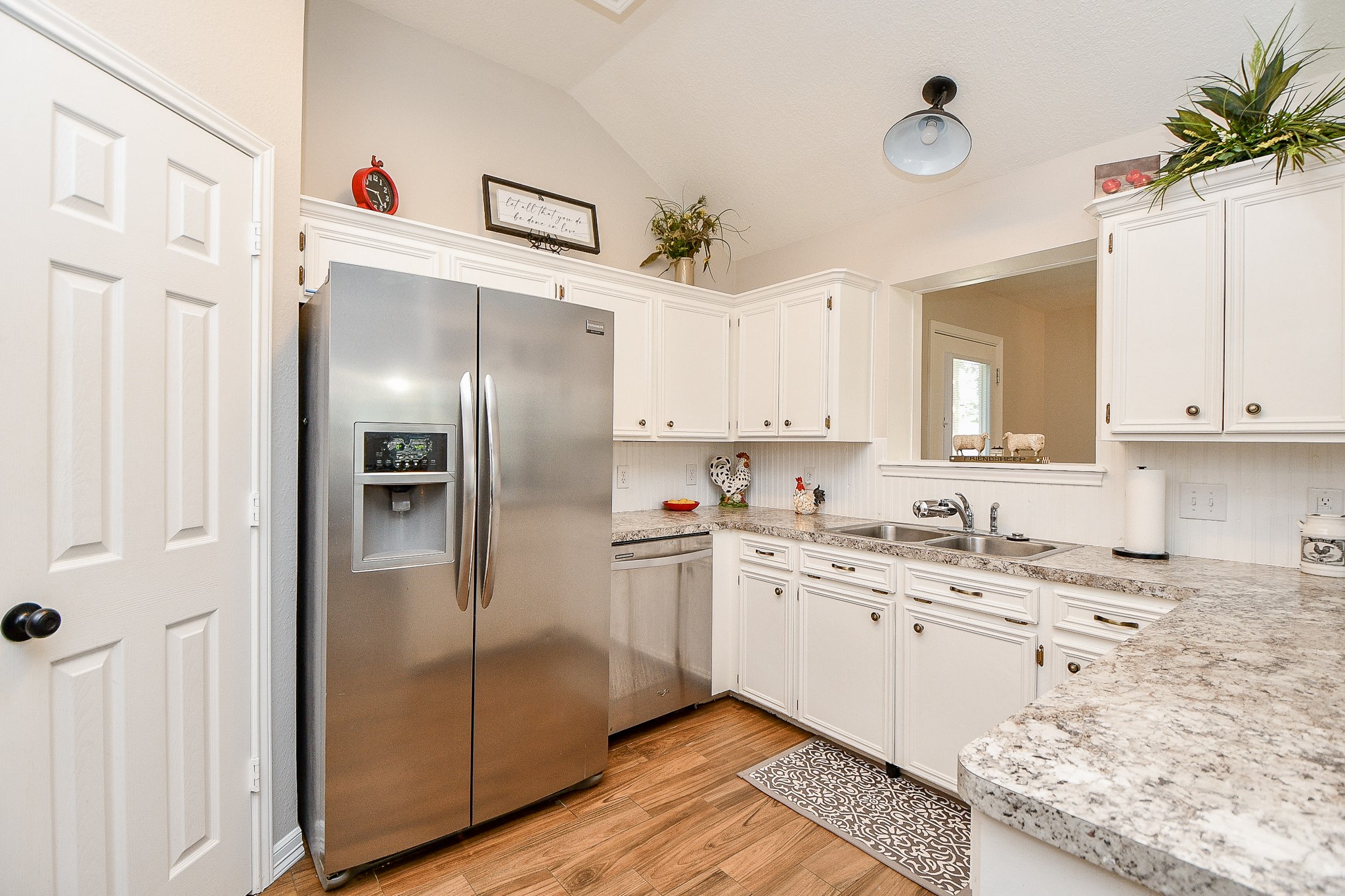 606 Walnut Street Sweeny, TX 77480 - Photo 11 of 28 You can serve food through the open window to the Dining Room