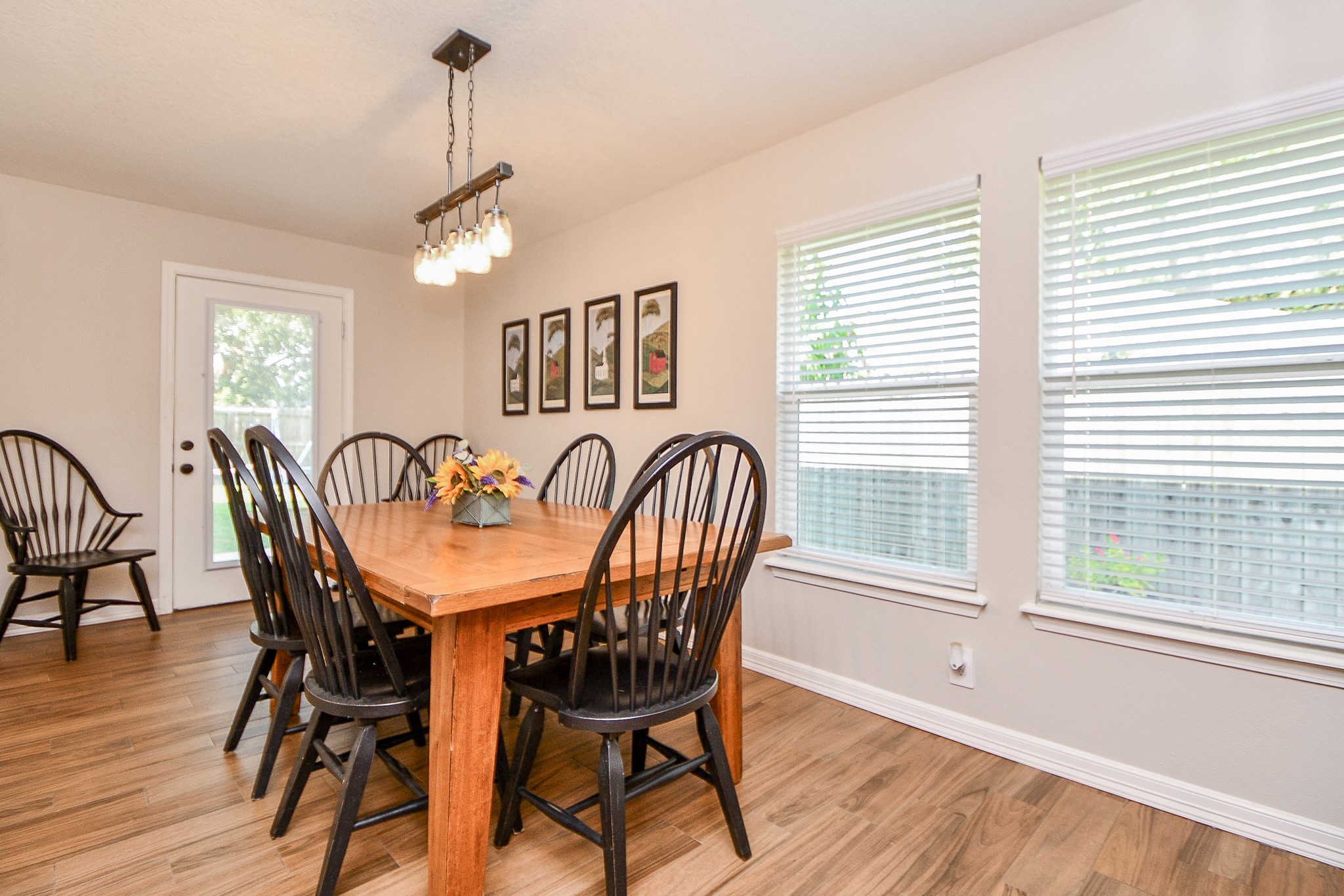 606 Walnut Street Sweeny, TX 77480 - Photo 13 of 28 The Dining Room was once upon a time the back porch~ It has now been converted from an enclosed back porch to this lovely room with a wall of windows. The new Back Door added exits to a new decked Back Porch