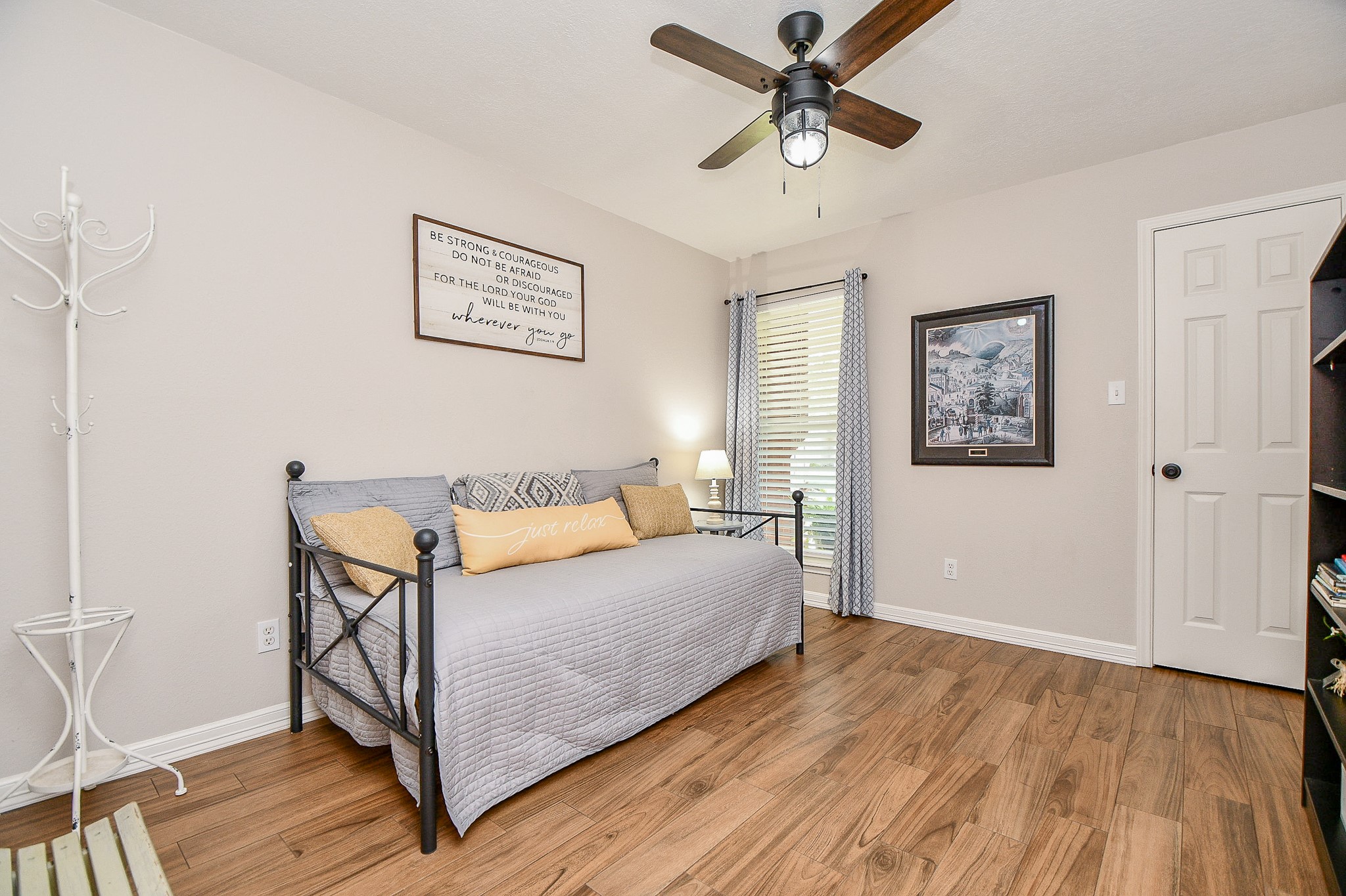606 Walnut Street Sweeny, TX 77480 - Photo 18 of 28 This is the 1st Guest Bedroom with a walk in closet with of course, new flooring, paint and ceiling fan