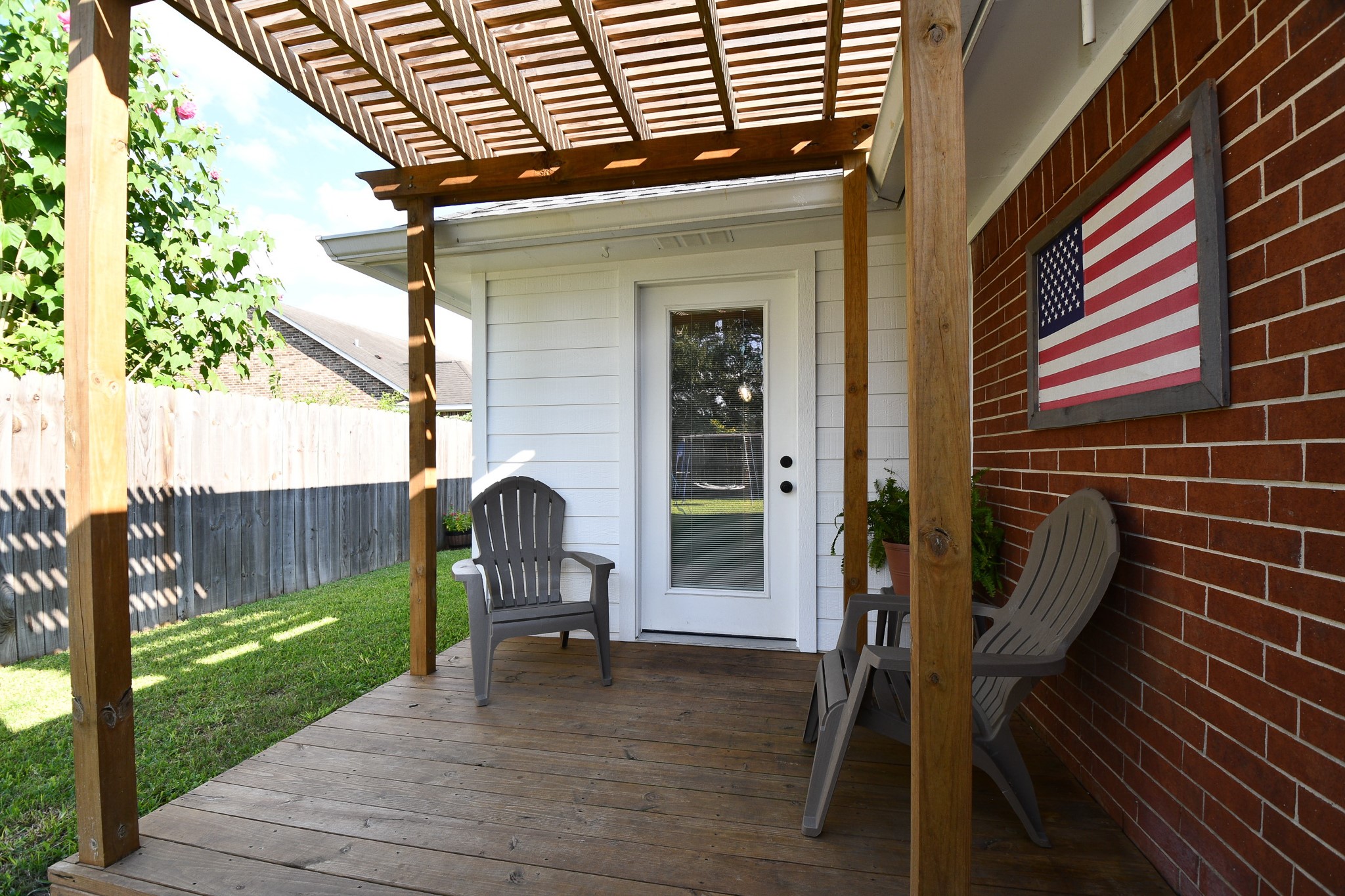 606 Walnut Street Sweeny, TX 77480 - Photo 25 of 28 The pergola gives shade to enjoy your yard. This is the afternoon view with lots of shade