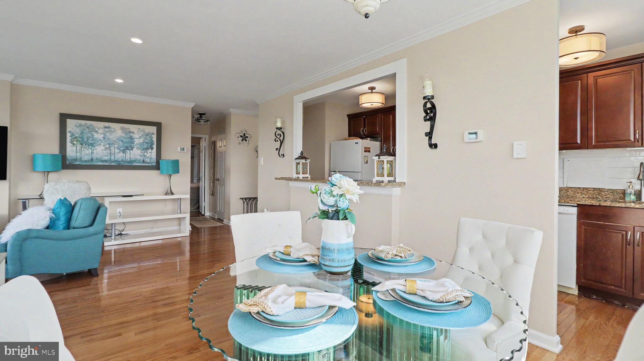 4000 Tunlaw Road Northwest, Unit 1111 Washington, DC 20007 - Photo 9 of 33 Open plan living room / dining area