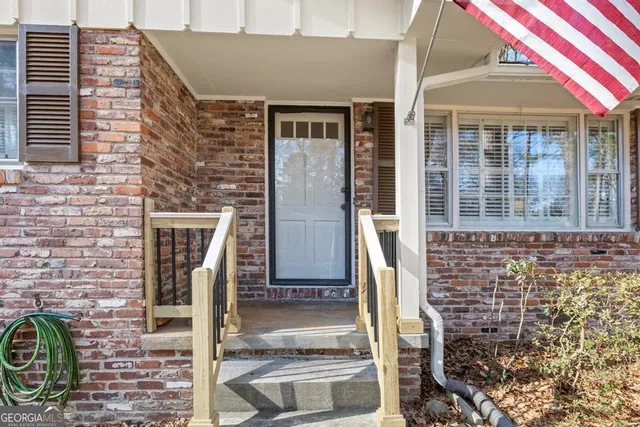 a front view of a house with glass windows