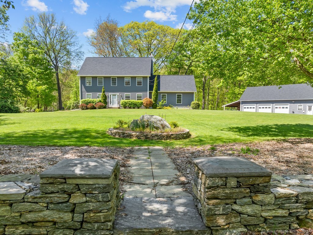 Beautiful Colonial with Stone Walls and 5 Garage Spaces!