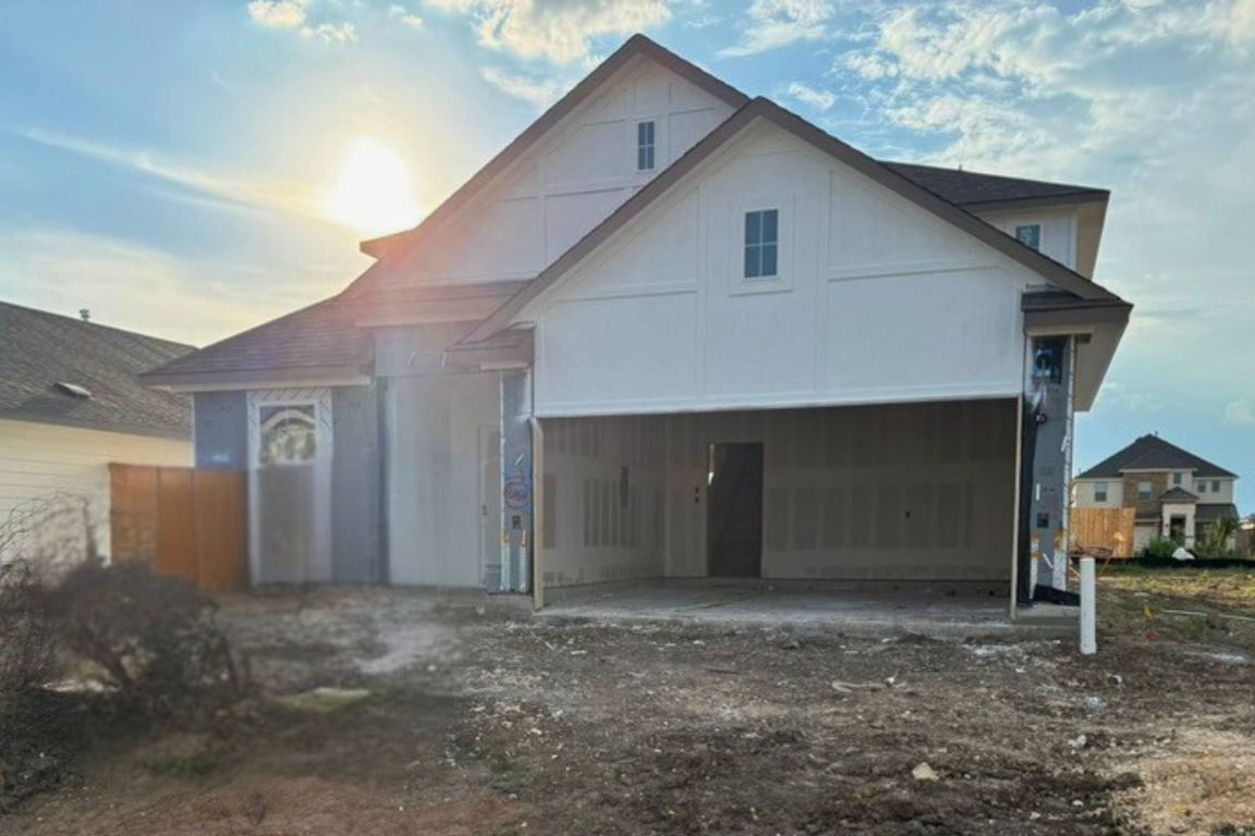 a house view with a backyard space