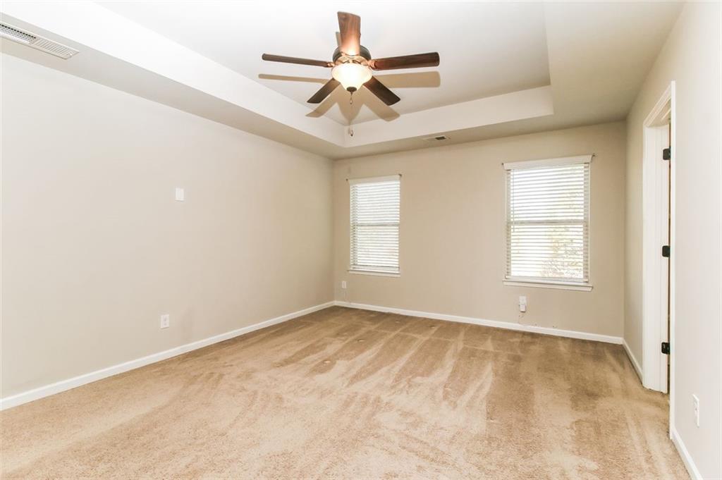 195 Skipjack Court Covington, GA 30016 - Photo 8 of 15 wooden floor in an empty room with a window