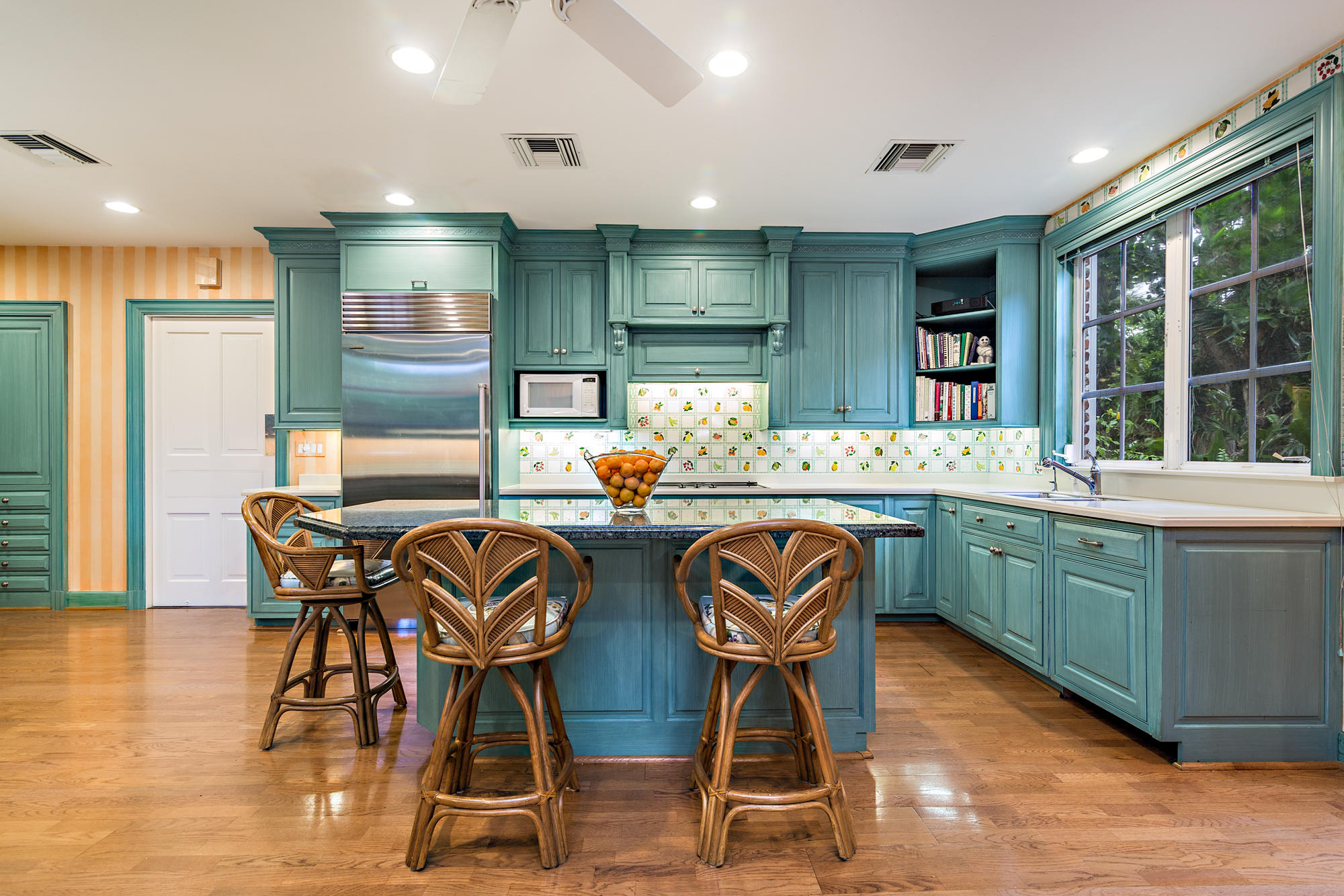 568 Island Drive Palm Beach, FL 33480 - Photo 15 of 34 a dining hall with stainless steel appliances granite countertop a kitchen island attached withe living room