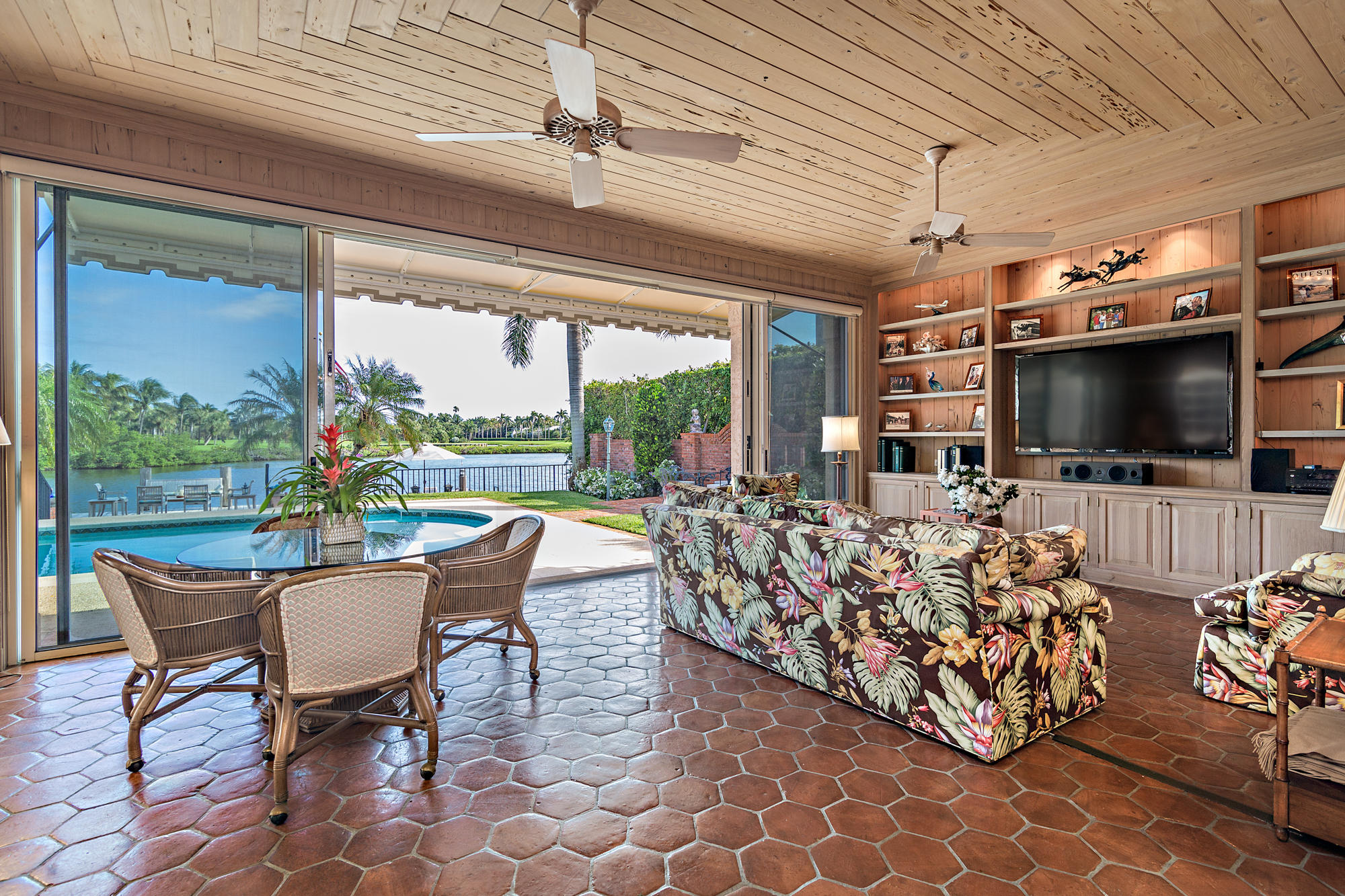 568 Island Drive Palm Beach, FL 33480 - Photo 16 of 34 a living room with patio furniture and a flat screen tv