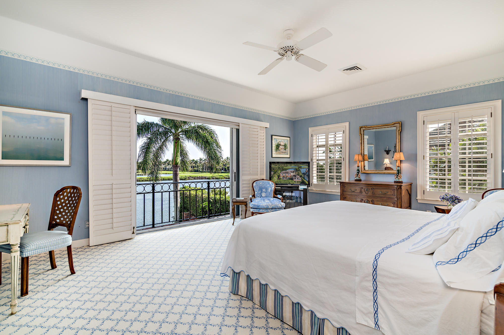 568 Island Drive Palm Beach, FL 33480 - Photo 20 of 34 a bedroom with a bed a large window and walk in closet