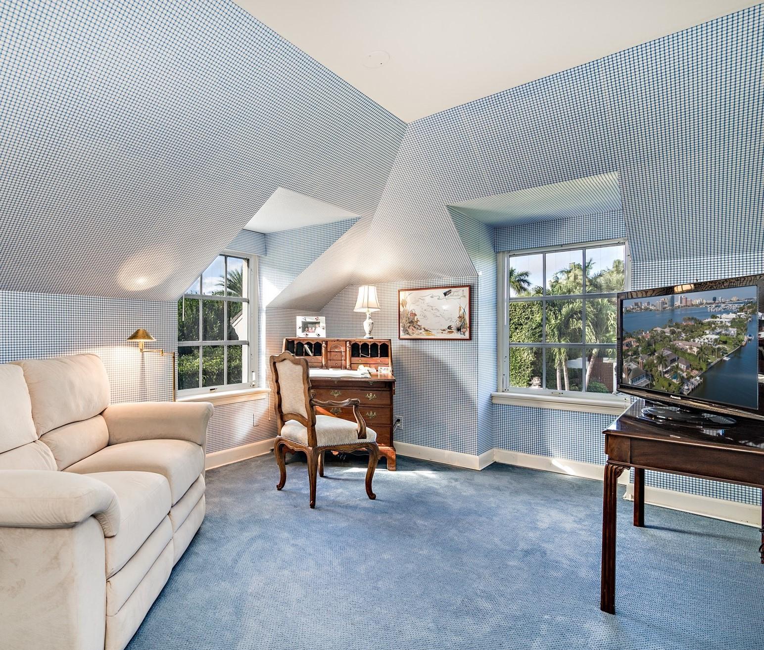 568 Island Drive Palm Beach, FL 33480 - Photo 26 of 34 a living room with furniture and a flat screen tv