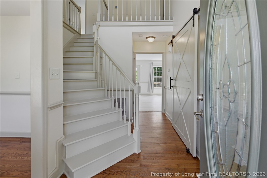 1075 Buffalo Lake Road Sanford, NC 27332 - Photo 3 of 49 a view of a hallway with wooden floor and entryway