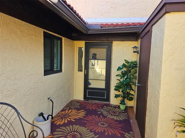 a backyard of a house with seating space