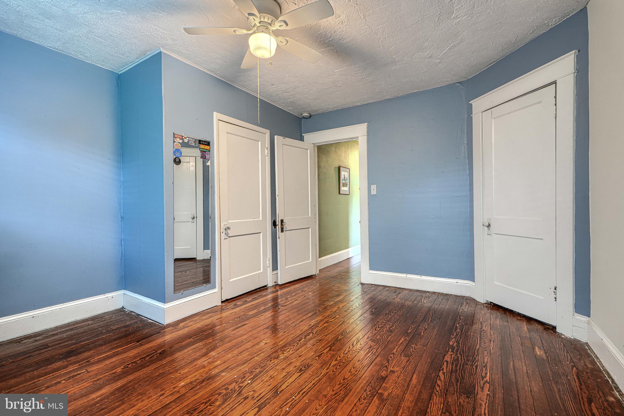 2705 Latona Road Baltimore, MD 21214 - Photo 42 of 53 a view of an empty room with wooden floor