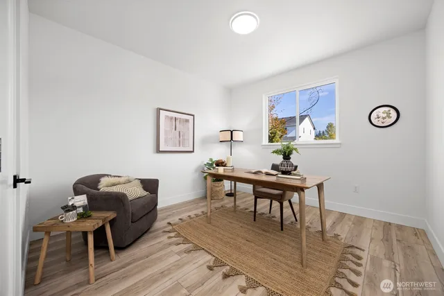 a work room with furniture and wooden floor