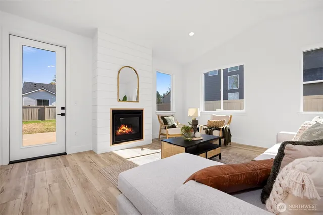 a bedroom with furniture and a fireplace
