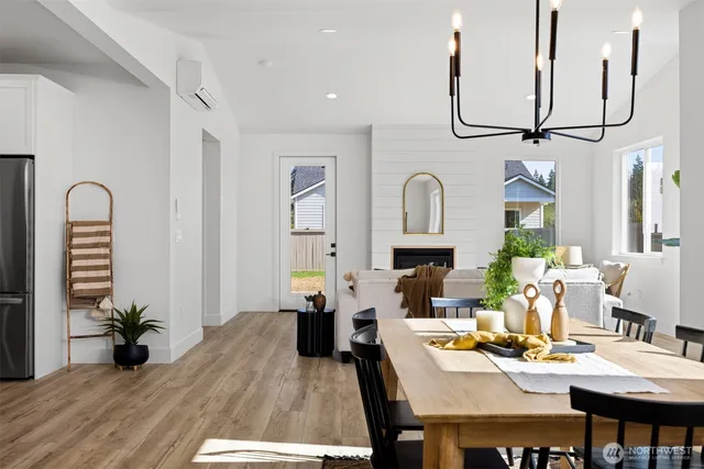 a view of a dining room with furniture window and wooden floor