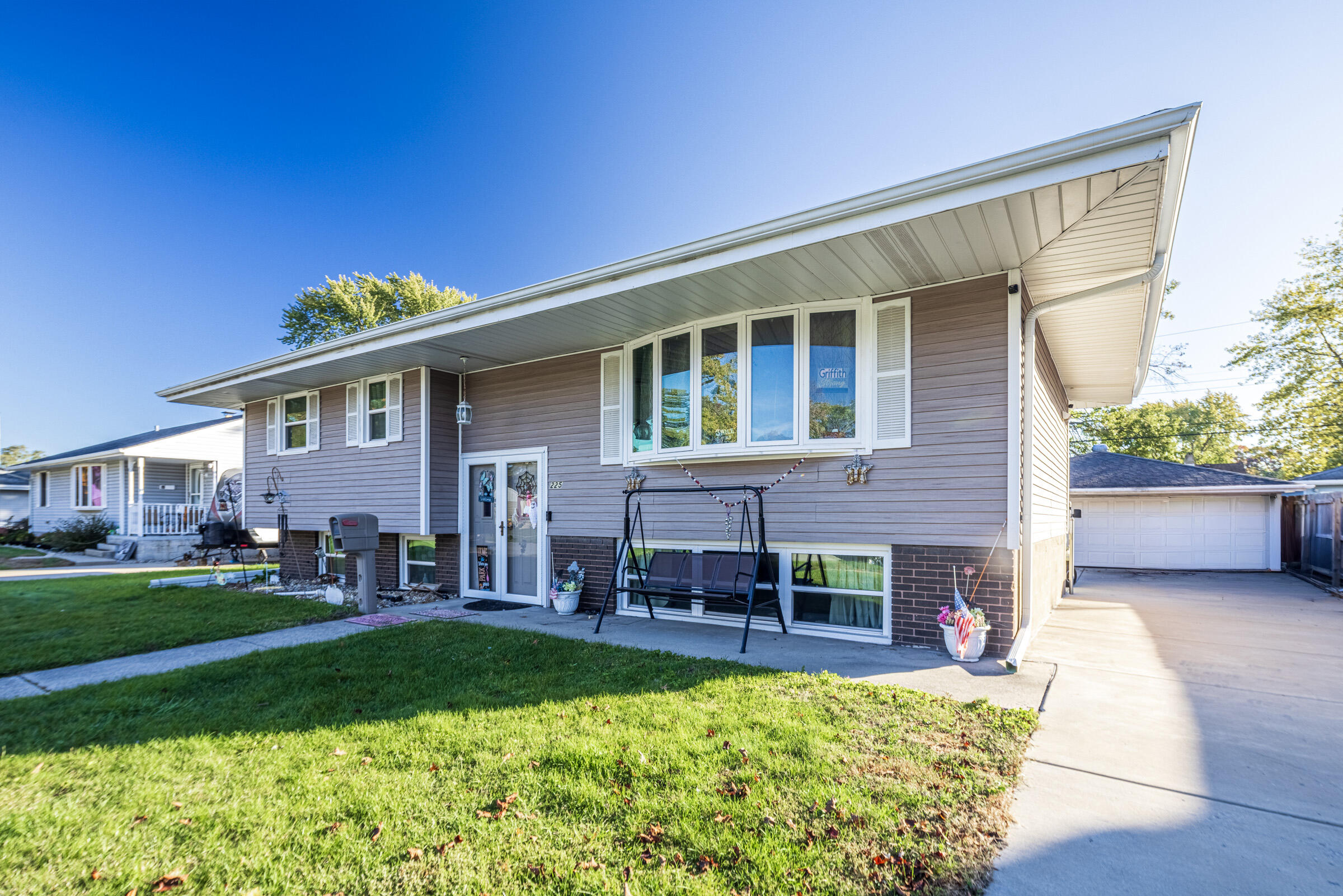 a view of house with a yard