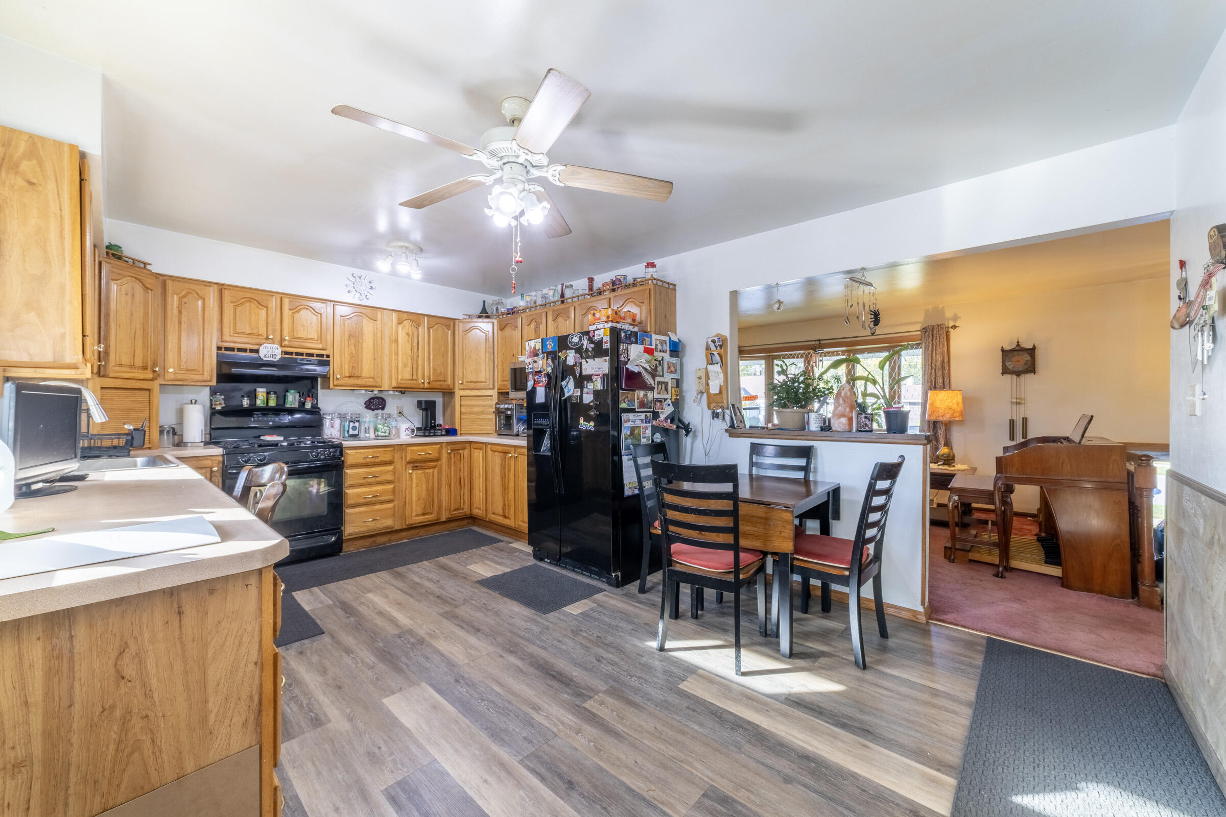 225 North Dwiggins Street Griffith, IN 46319 - Photo 12 of 36 a dining room filled with furniture and wooden floor