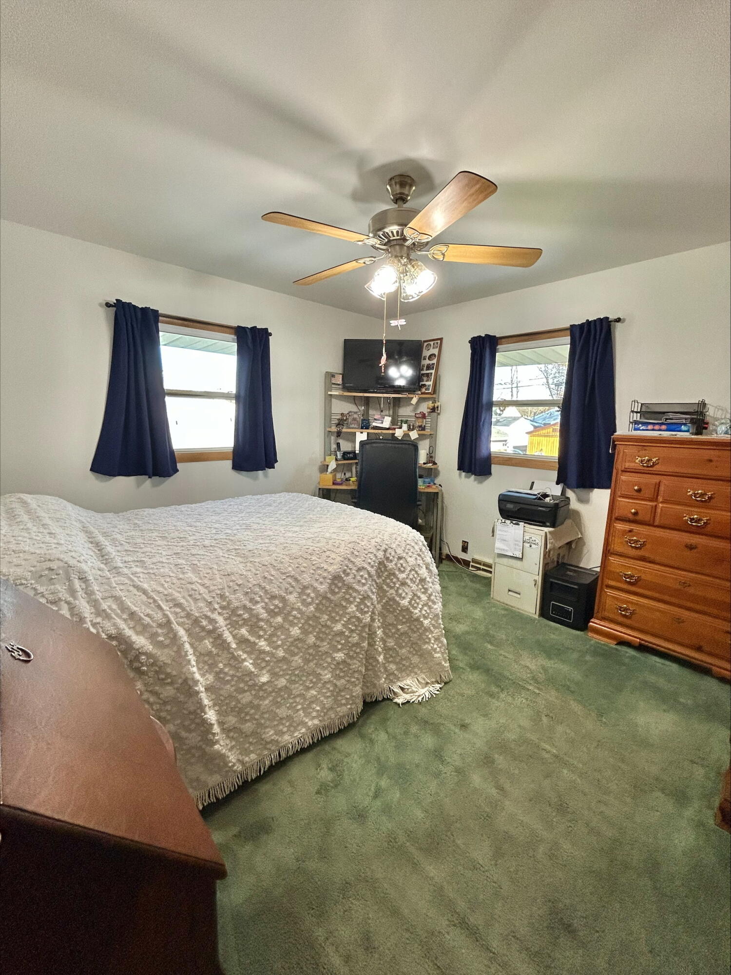 225 North Dwiggins Street Griffith, IN 46319 - Photo 17 of 36 a bedroom with a bed and a chandelier