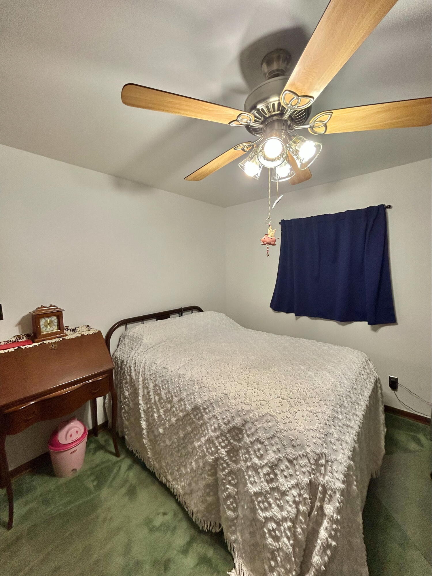 225 North Dwiggins Street Griffith, IN 46319 - Photo 18 of 36 a bedroom with a bed and a chandelier