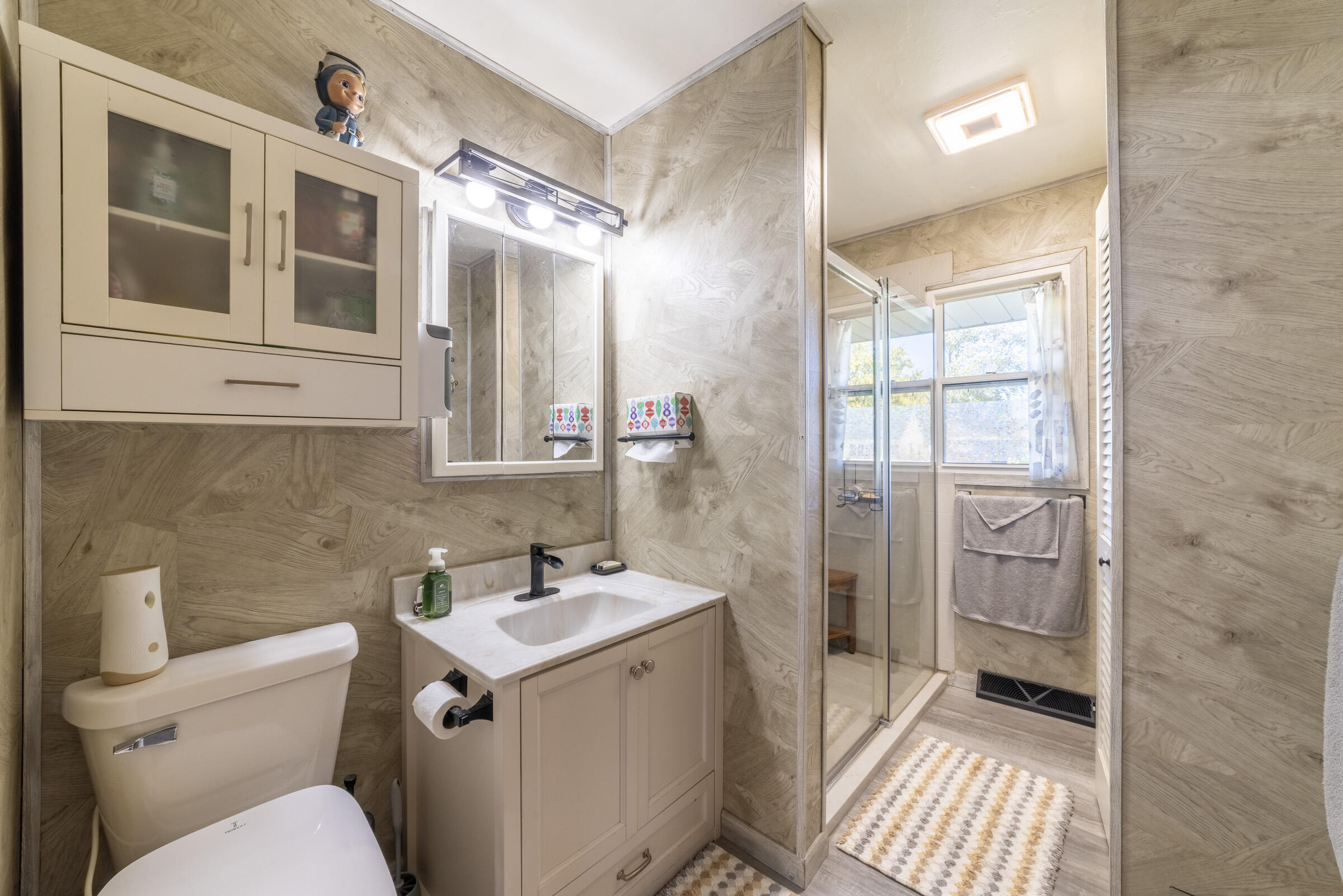 225 North Dwiggins Street Griffith, IN 46319 - Photo 19 of 36 a bathroom with a sink toilet and shower