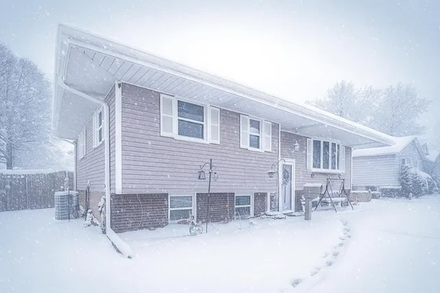 a backyard of a house with yard and outdoor seating