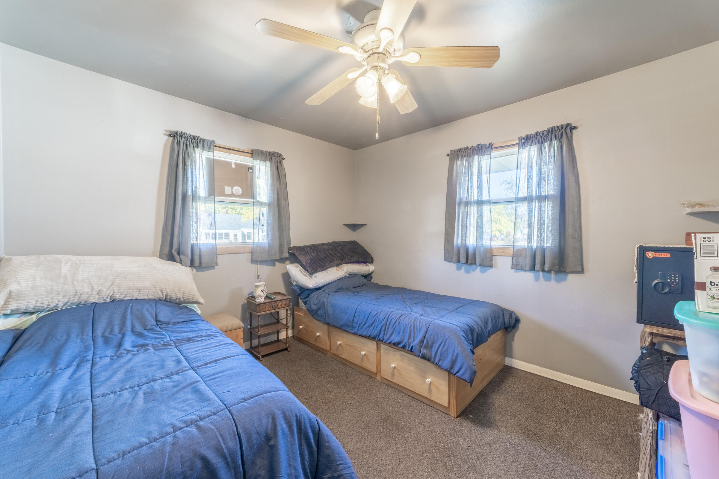 225 North Dwiggins Street Griffith, IN 46319 - Photo 21 of 36 a bedroom with two beds and a chandelier
