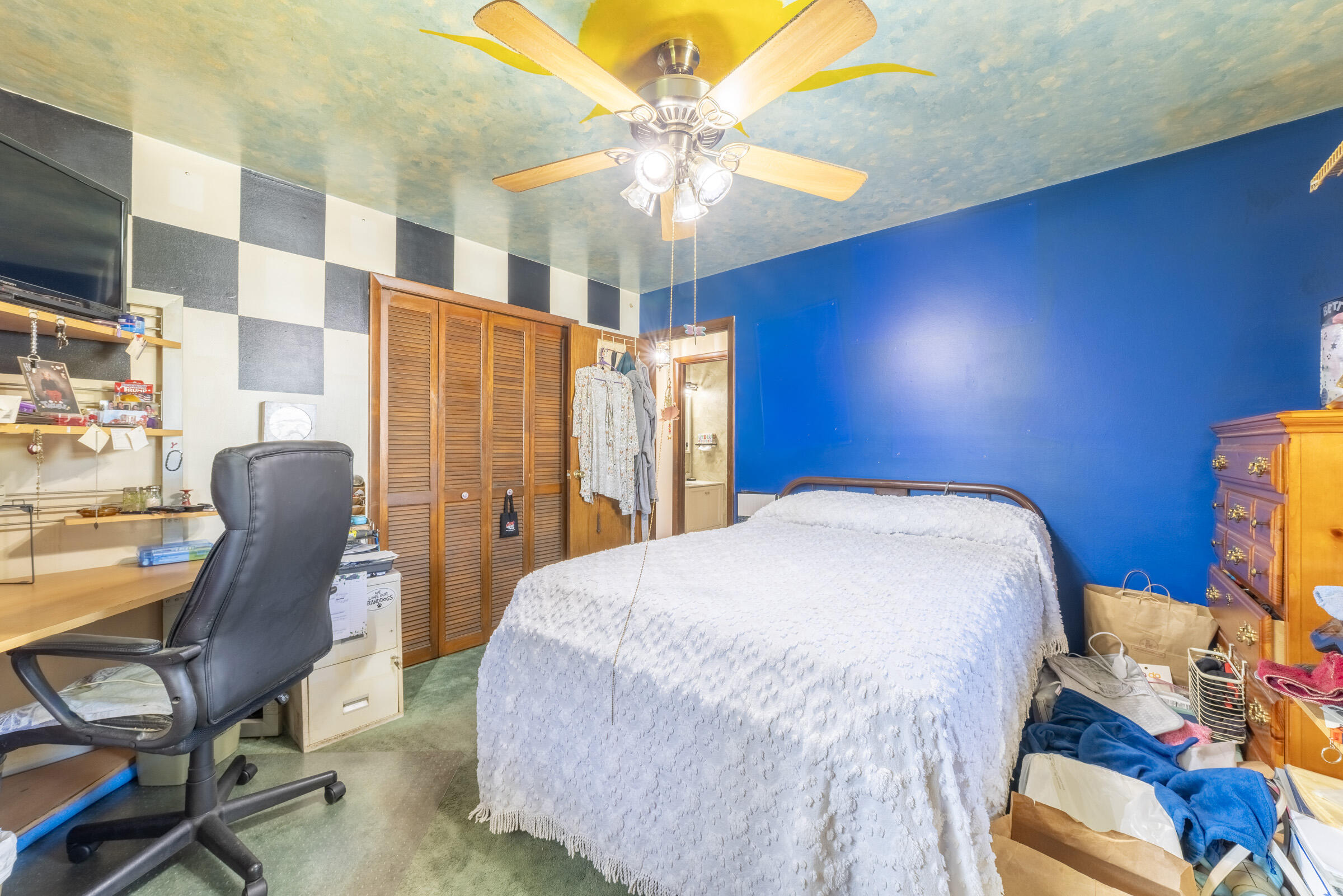 225 North Dwiggins Street Griffith, IN 46319 - Photo 22 of 36 a bedroom with a bed a table and chair