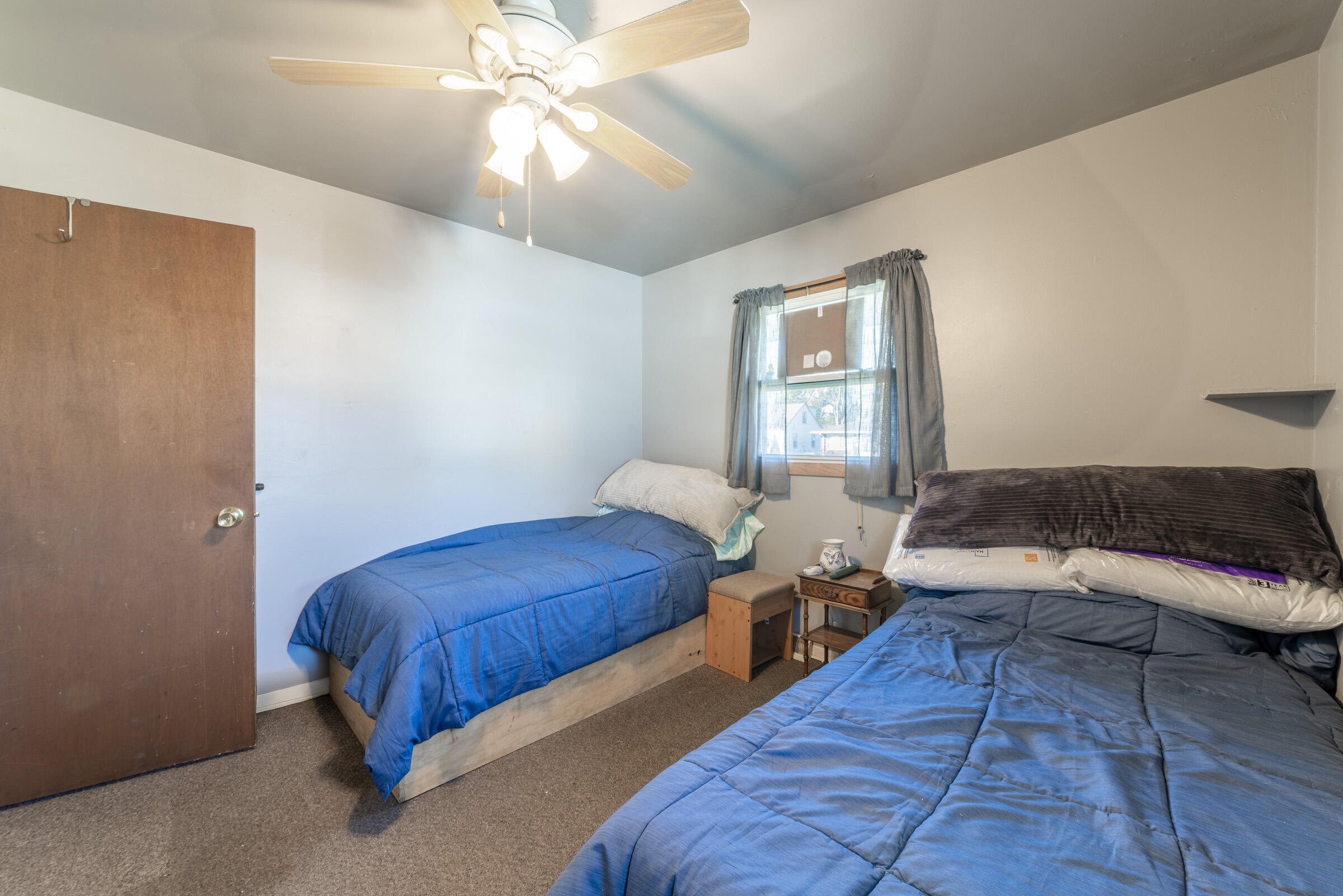 225 North Dwiggins Street Griffith, IN 46319 - Photo 23 of 36 a bedroom with 2 bed and a window