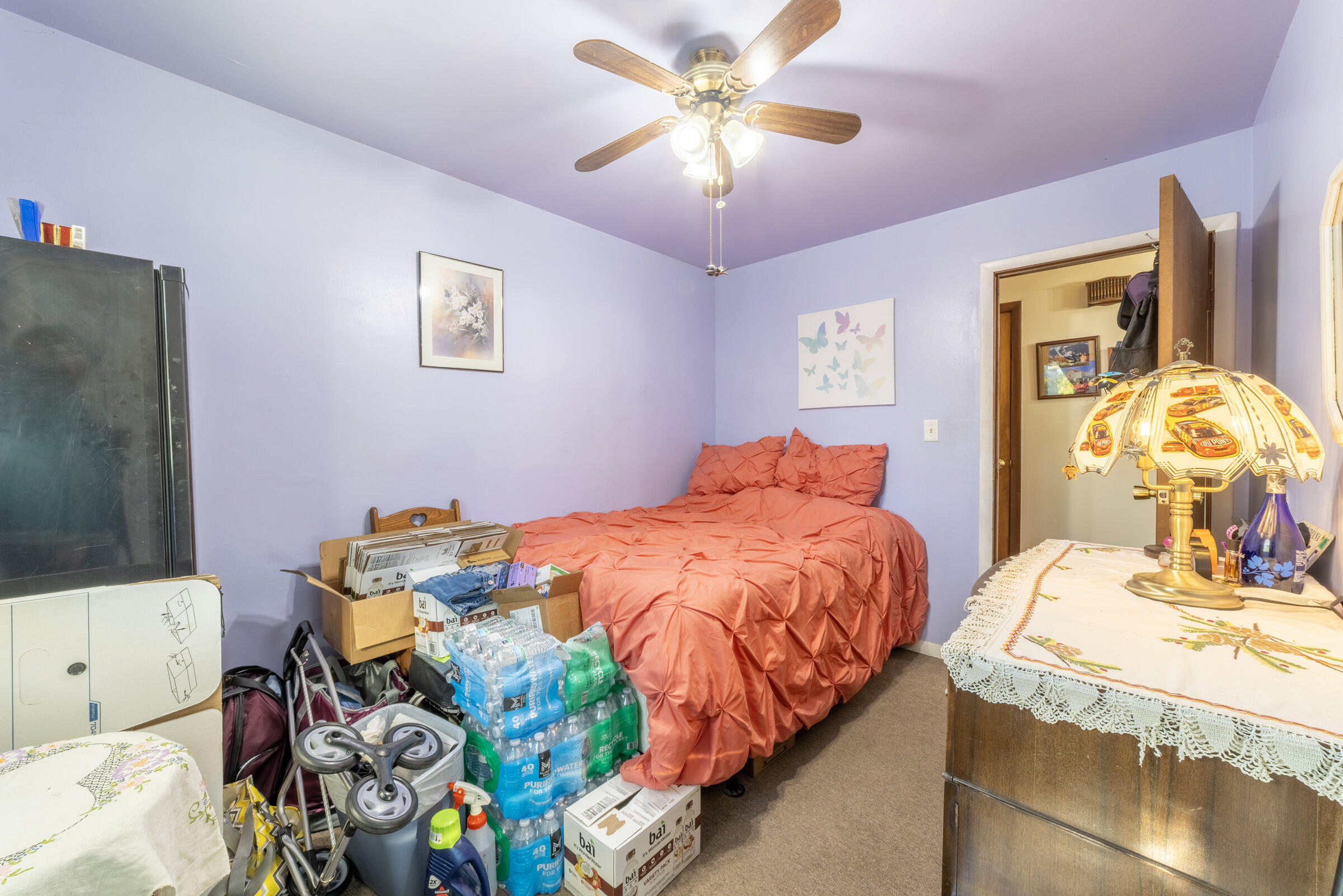 225 North Dwiggins Street Griffith, IN 46319 - Photo 25 of 36 a bedroom with a bed and a chandelier