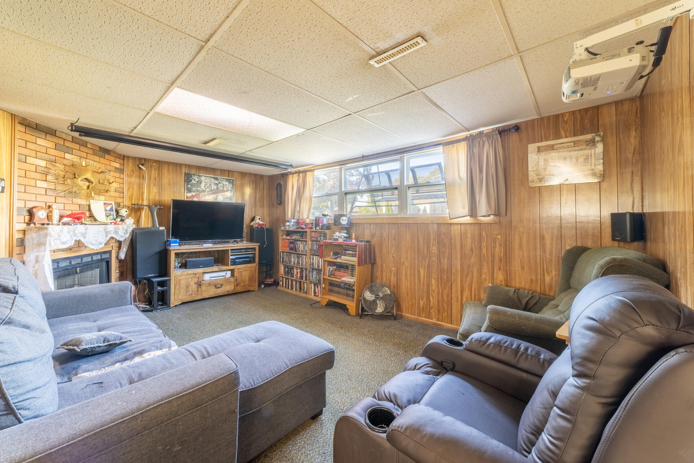 225 North Dwiggins Street Griffith, IN 46319 - Photo 26 of 36 a living room with furniture and a flat screen tv