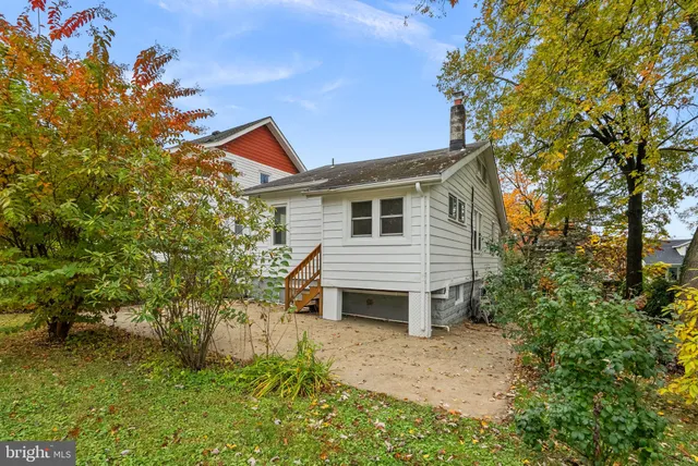 a house that has a tree in front of it