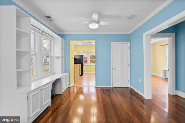 a view of hallway with wooden floor
