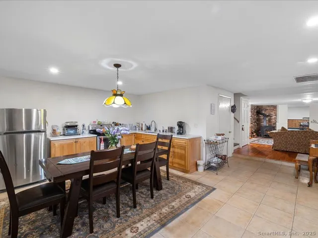 a dining room with furniture and window