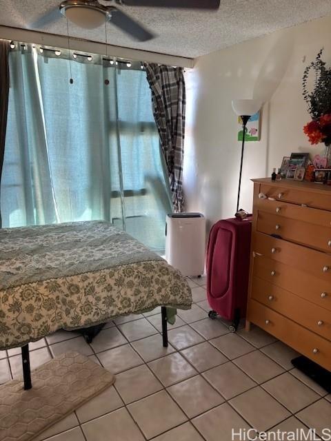 454 Nāmāhana Street, Unit 501 Honolulu, HI 96815 - Photo 4 of 5 a bedroom with a bed and a mirror