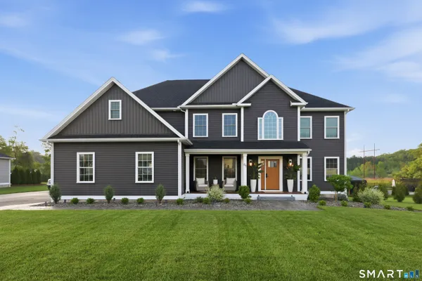 a front view of a house with a yard
