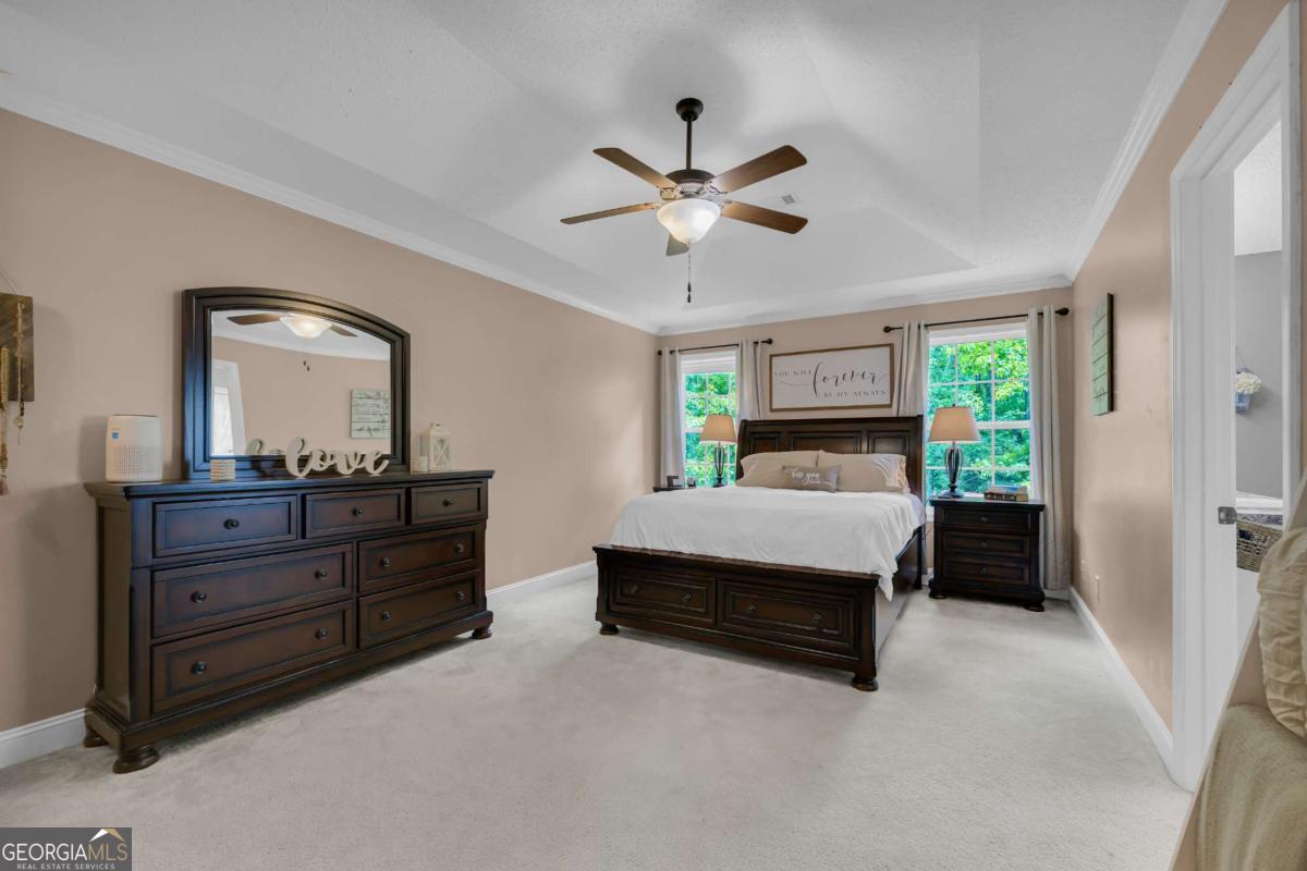 335 Elizabeth Court Colbert, GA 30628 - Photo 17 of 33 a bed room with a bed and a mirror