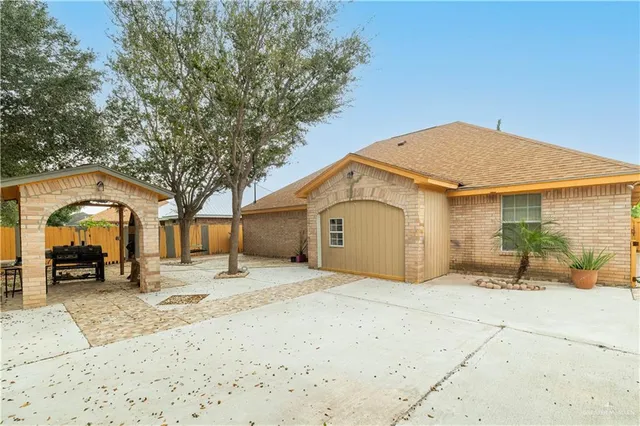 a view of a house with snow in front of it