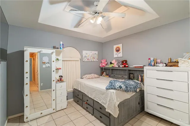 a bedroom with a bed and cabinets