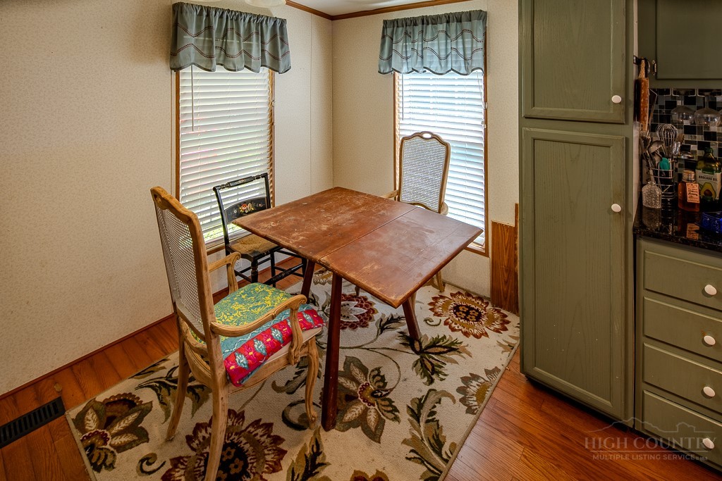 461 Reuben Wooten Road Banner Elk, NC 28604 - Photo 17 of 39 a view of a room that has a table and chair in it