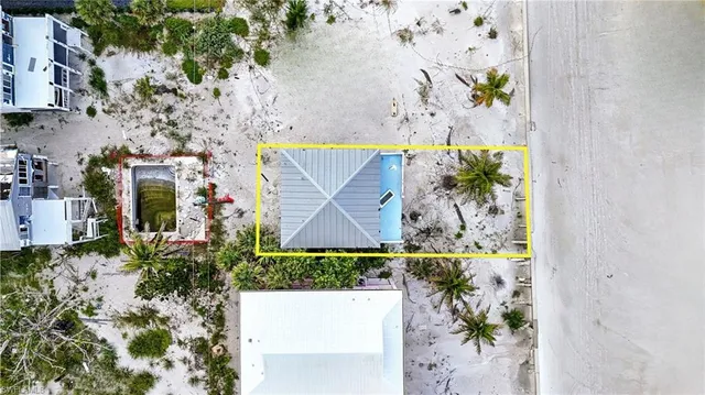 an aerial view of a house with outdoor space