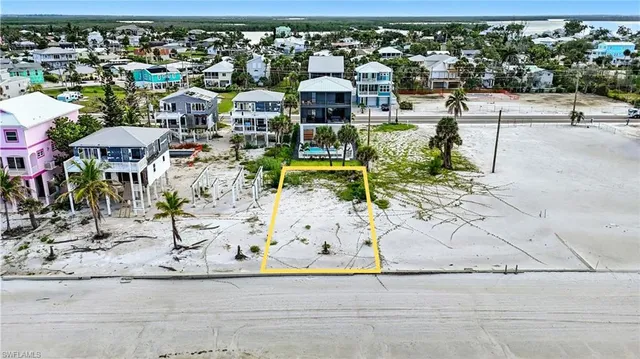 an aerial view of houses with outdoor space
